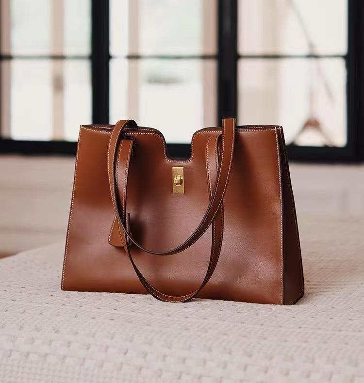 Elegant Leather Handbag with Gold Lock Detail