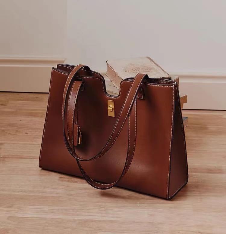 Elegant Leather Handbag with Gold Lock Detail