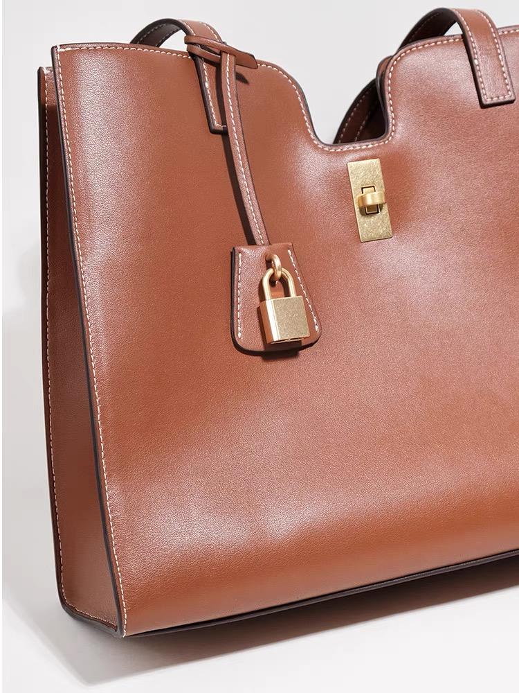 Elegant Leather Handbag with Gold Lock Detail